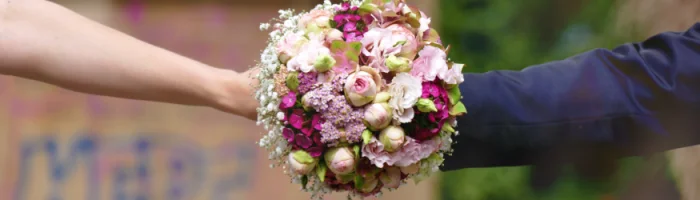 Bride and Groom holding the bridal bouquet